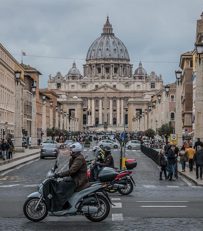 People on mopeds on the street